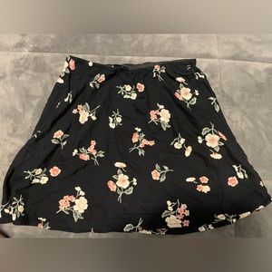 Black flowery skirt Hollister that is medium size . Only worn once